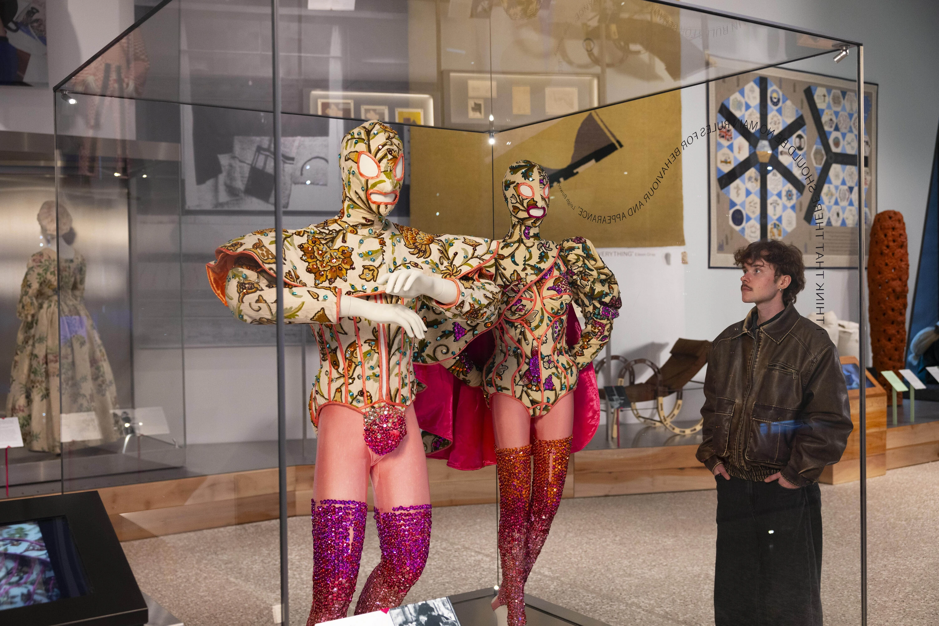 Sparkly pink male and female ballet ensembles with capes and masks made by Leigh Bowery