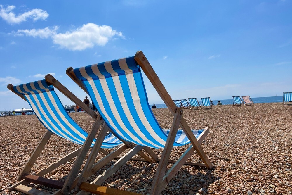 Loungers on the beach at Brighton, England