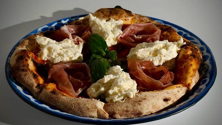 Replenish your carb craving with a cheesy slide of Adirak Pizza