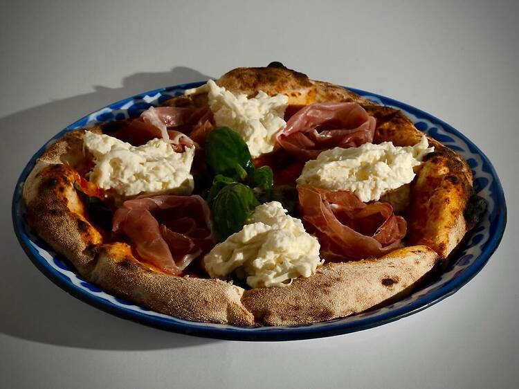 Replenish your carb craving with a cheesy slide of Adirak Pizza