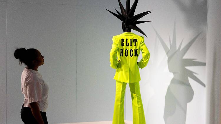 Skin from Skunk Anansie’s neon yellow Clit Rock suit in 'The Music Is Black’ exhibition at V&A East