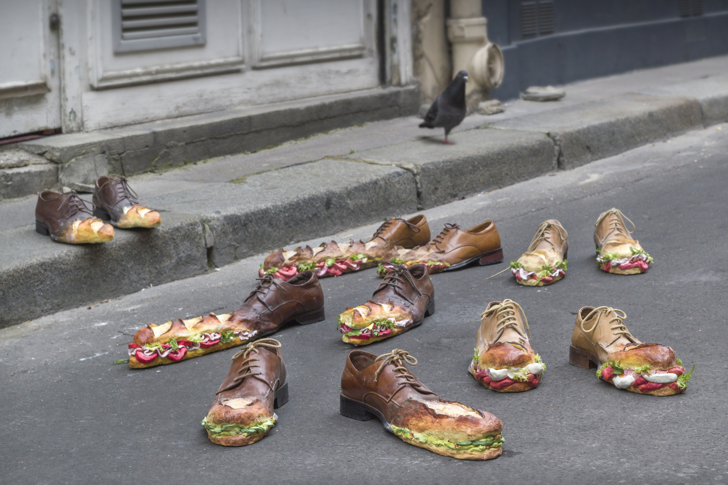 Sculptures of shoes morphing into sandwiches