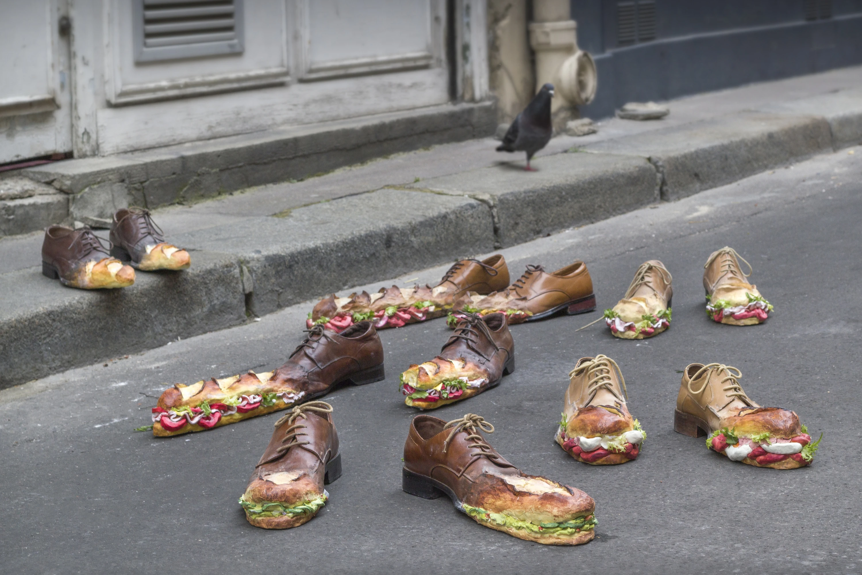 Sculptures of shoes morphing into sandwiches