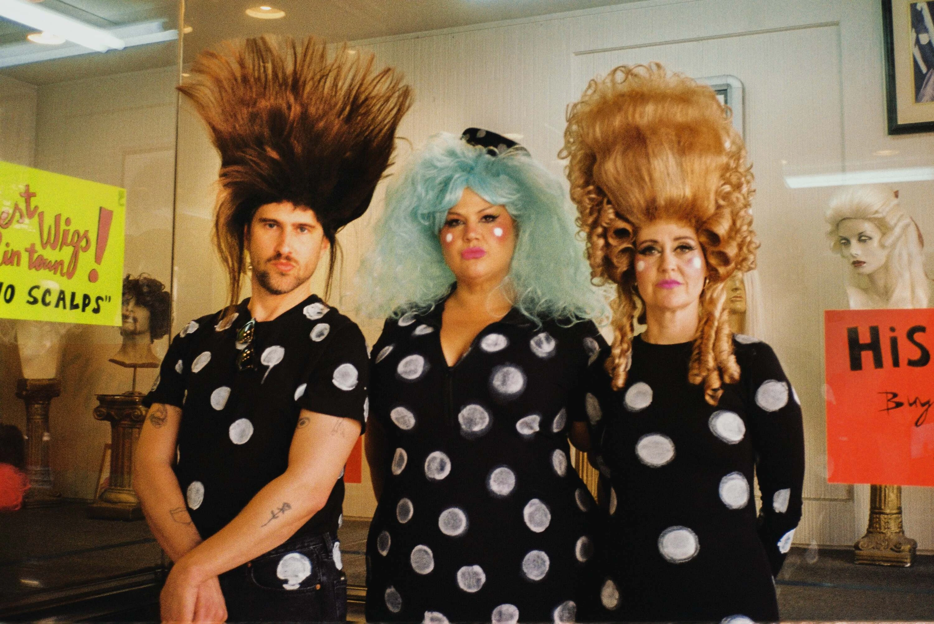 The three members of Hunx and his Punx wearing crazy wigs.