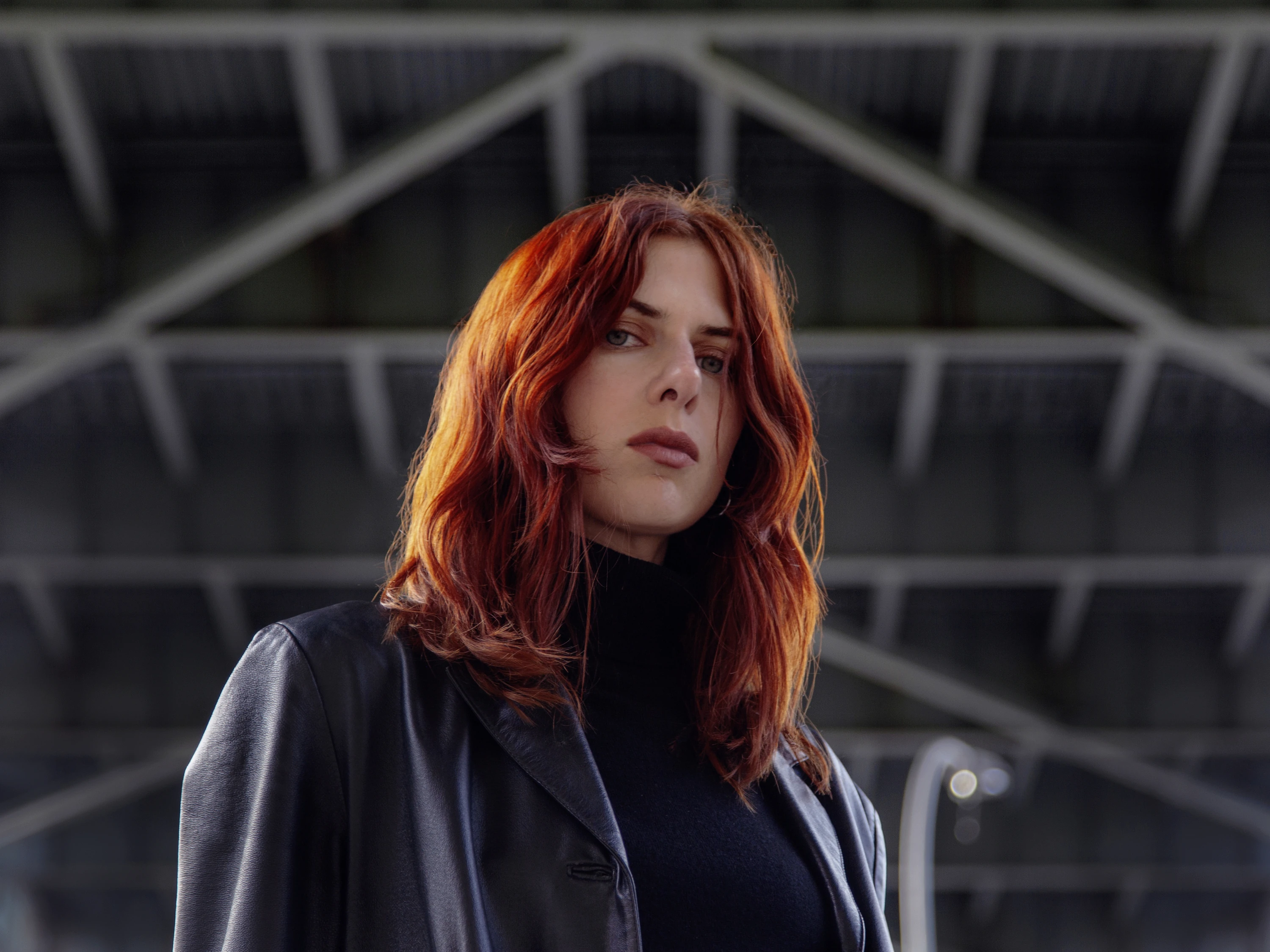 A portrait of Laurel Halo in a leather jacket.