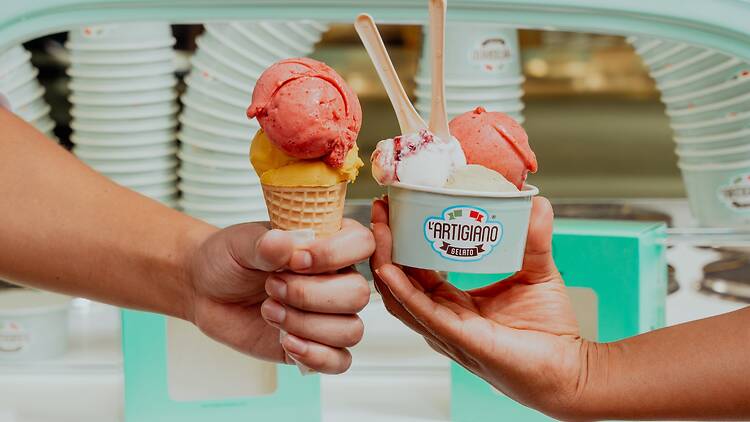 Two hands holding gelato