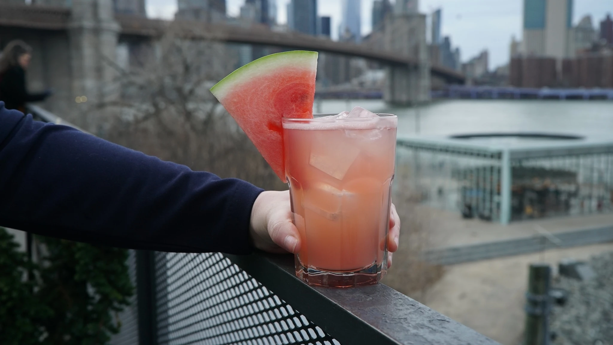 A margarita with a watermelon slice on it