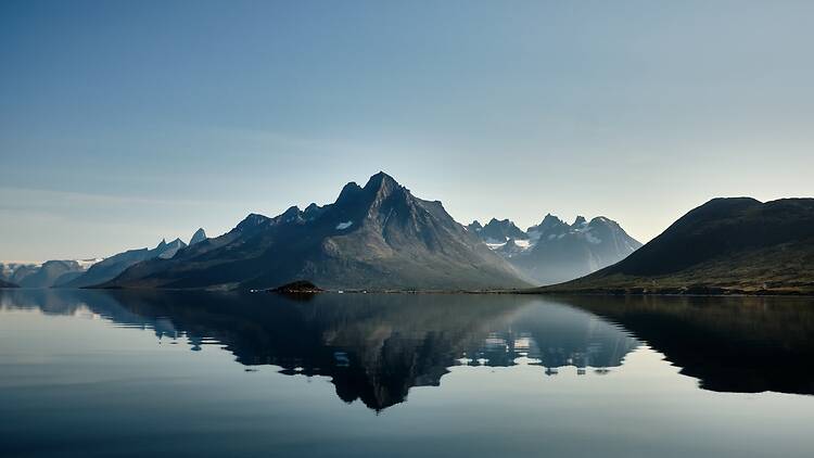 Mountains reflected in the fjord of Tasermiut, Greenland