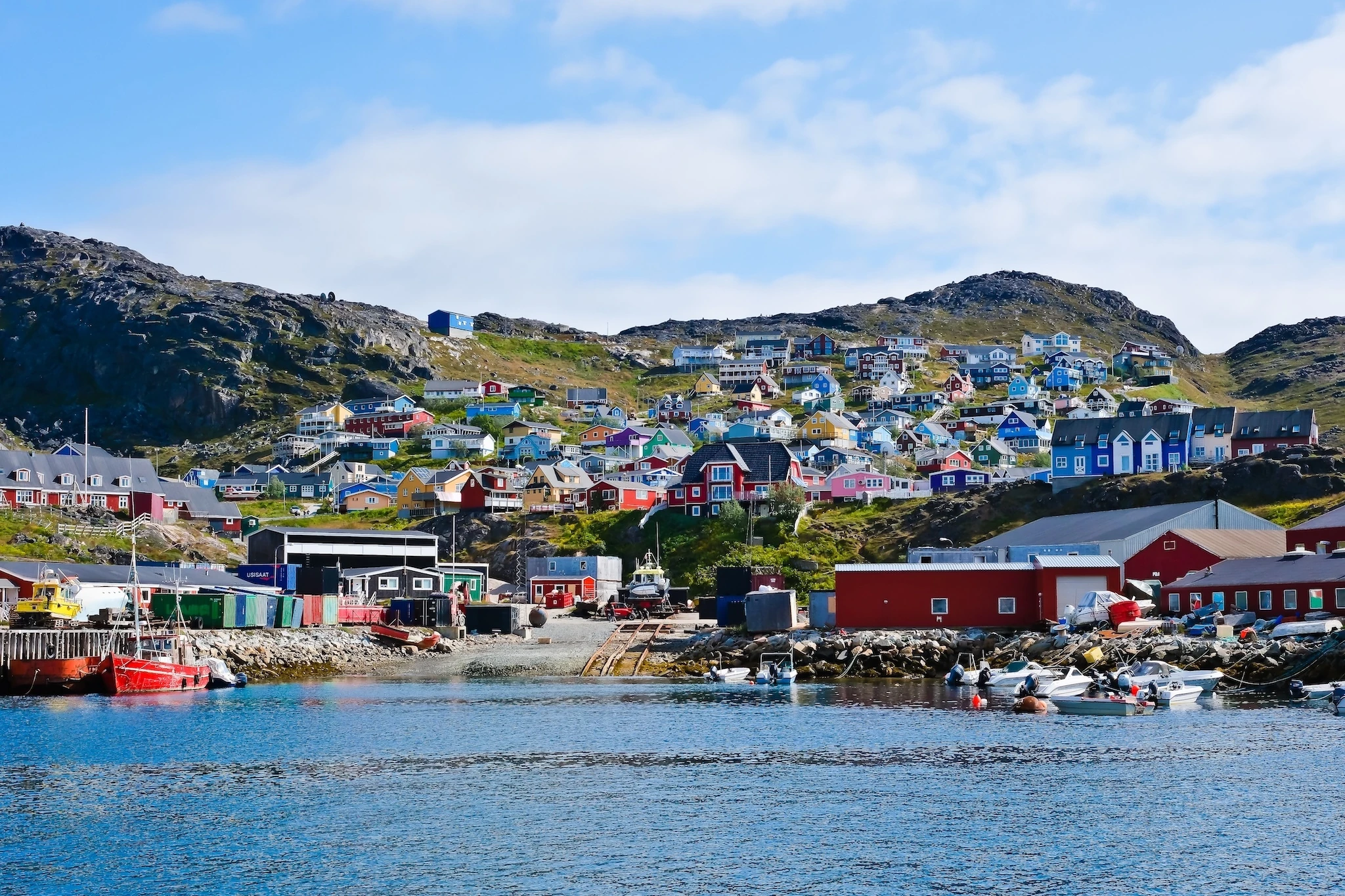 Scenic view of fjord town of Qaqortoq, Greenland, showing colourful houses