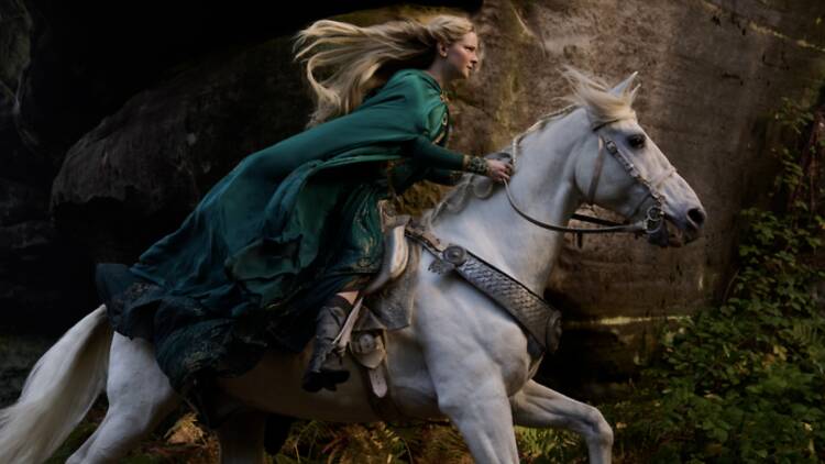 Morfydd Clark as Galadriel riding a horse in 'The Rings of Power'