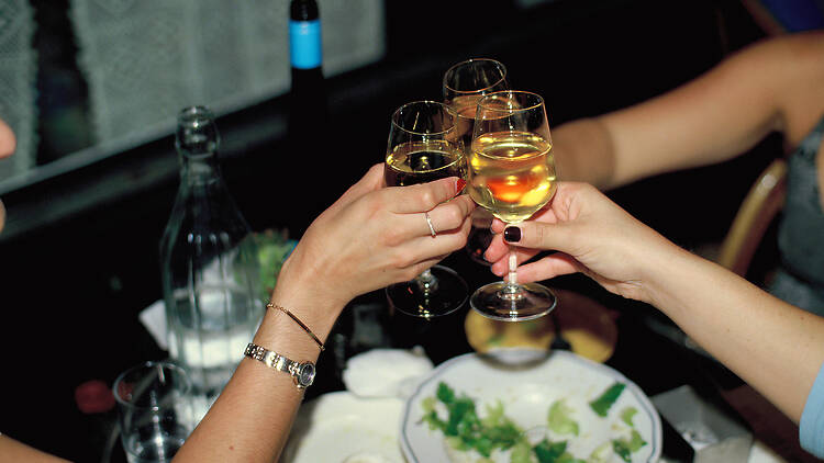 A toast with wine at an Arlo Communal event