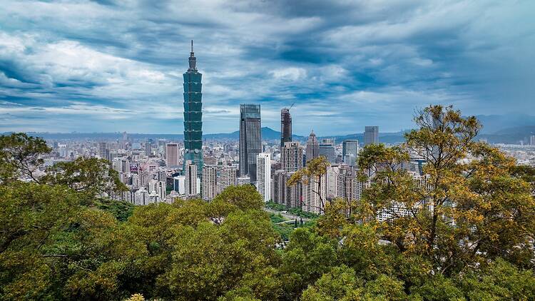 Stunning Taipei skyline with iconic buildings and lush greenery in the foreground
