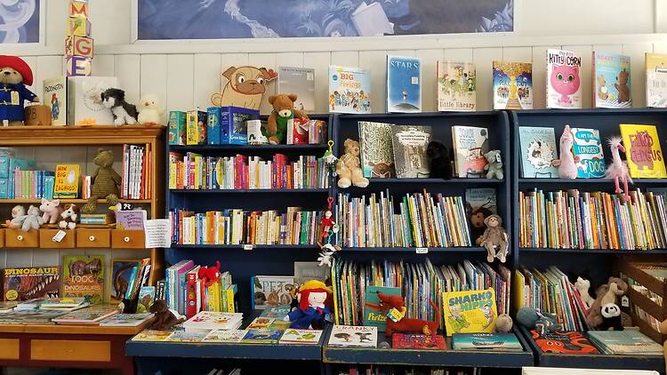 Shelves of children’s books and stuffed toys.