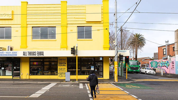 The yellow exterior of All Things Equal.