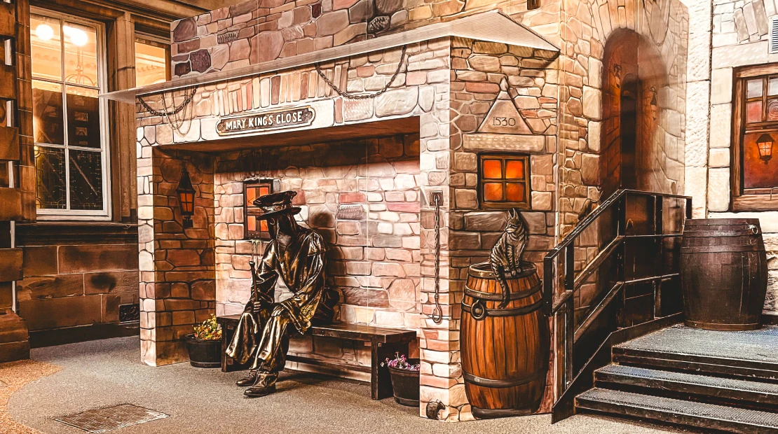 The Real Mary's King Close with bronze statue on bench