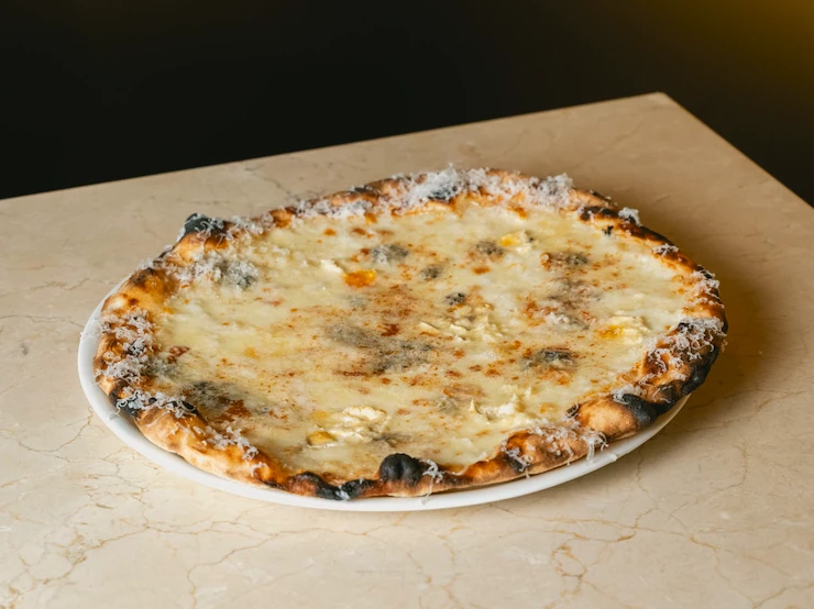 Pizza Tres quesos de Romo 