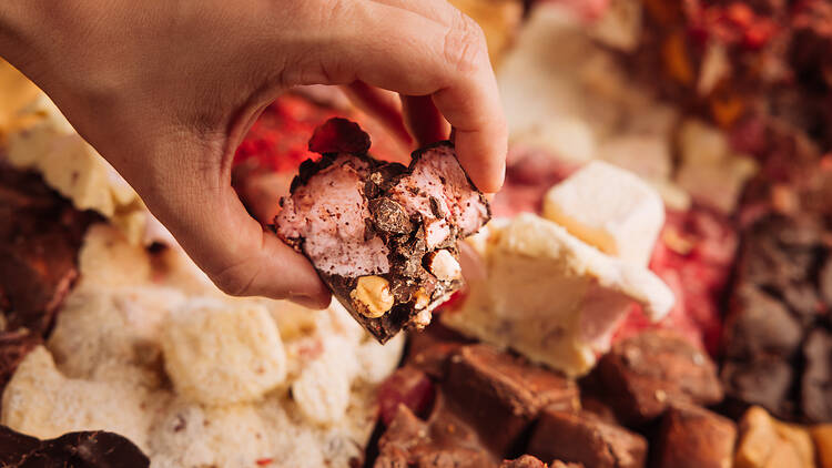 person picks a piece of Rocky Road