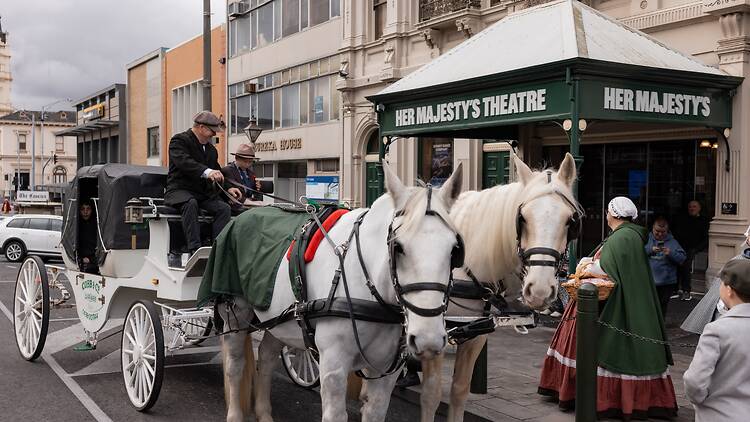 horse and carriage outside a theatre