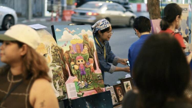 Wander Chakraphong Road while artists paint live and jazz floats past your ears
