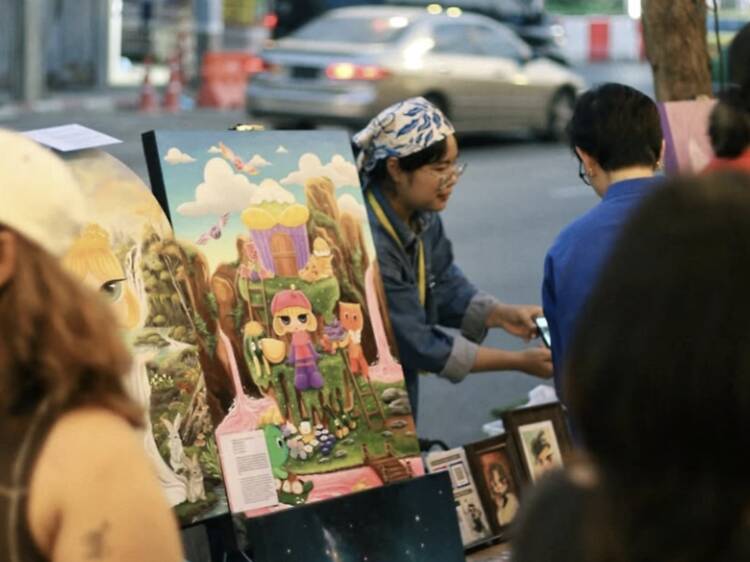 Wander Chakraphong Road while artists paint live and jazz floats past your ears