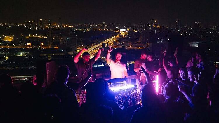 Lose yourself in deep house grooves as the city glows 360 around you