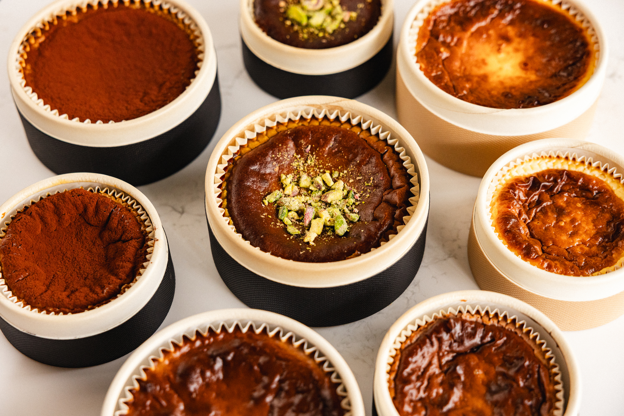 Eight Basque cheesecakes in a circle