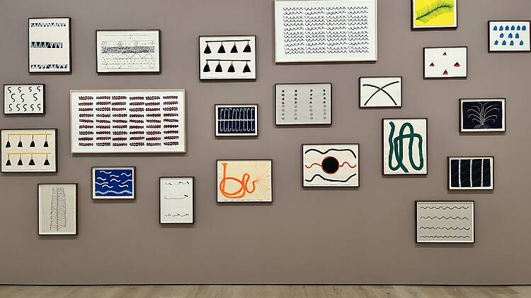 A wall of paintings in “Several Eternities in a Day: Form in the Age of Living Materials.”