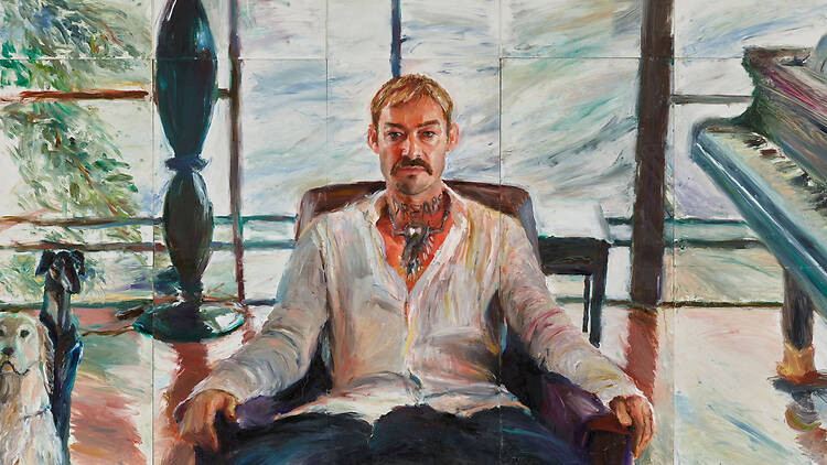 A fingerpainting of a musican sitting in a chair in a music room
