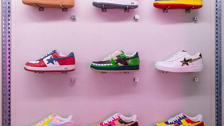 A wall diplay of Bape Sta trainers at ‘NIGO: From Japan with Love’ at the Design Museum