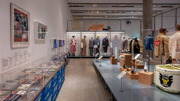 Mannequins and artefacts in glass display cabinets at ‘NIGO: From Japan with Love’ at the Design Museum