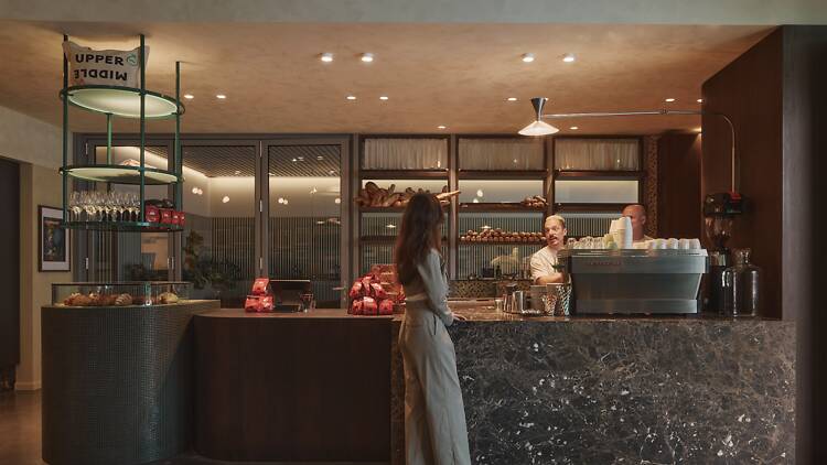 Upper Middle Person at counter in cafe
