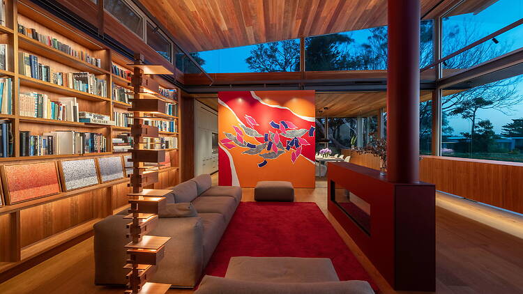 A moody interior of a wood-panelled house 