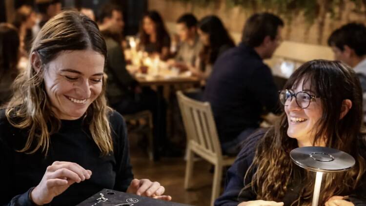 People laughing at Frida Crouton's Dining Escape Room 