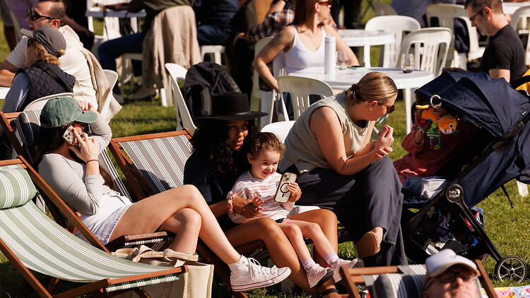 Pyrmont Festival people relaxing in the sun on outdoor chairs