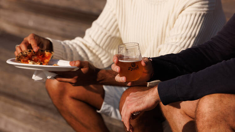 Pyrmont Festival men eating pizza and drinking beer