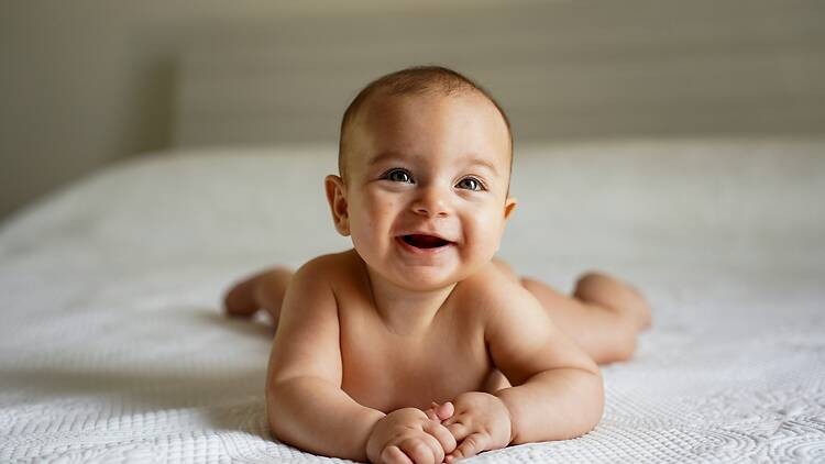 Baby on white bed