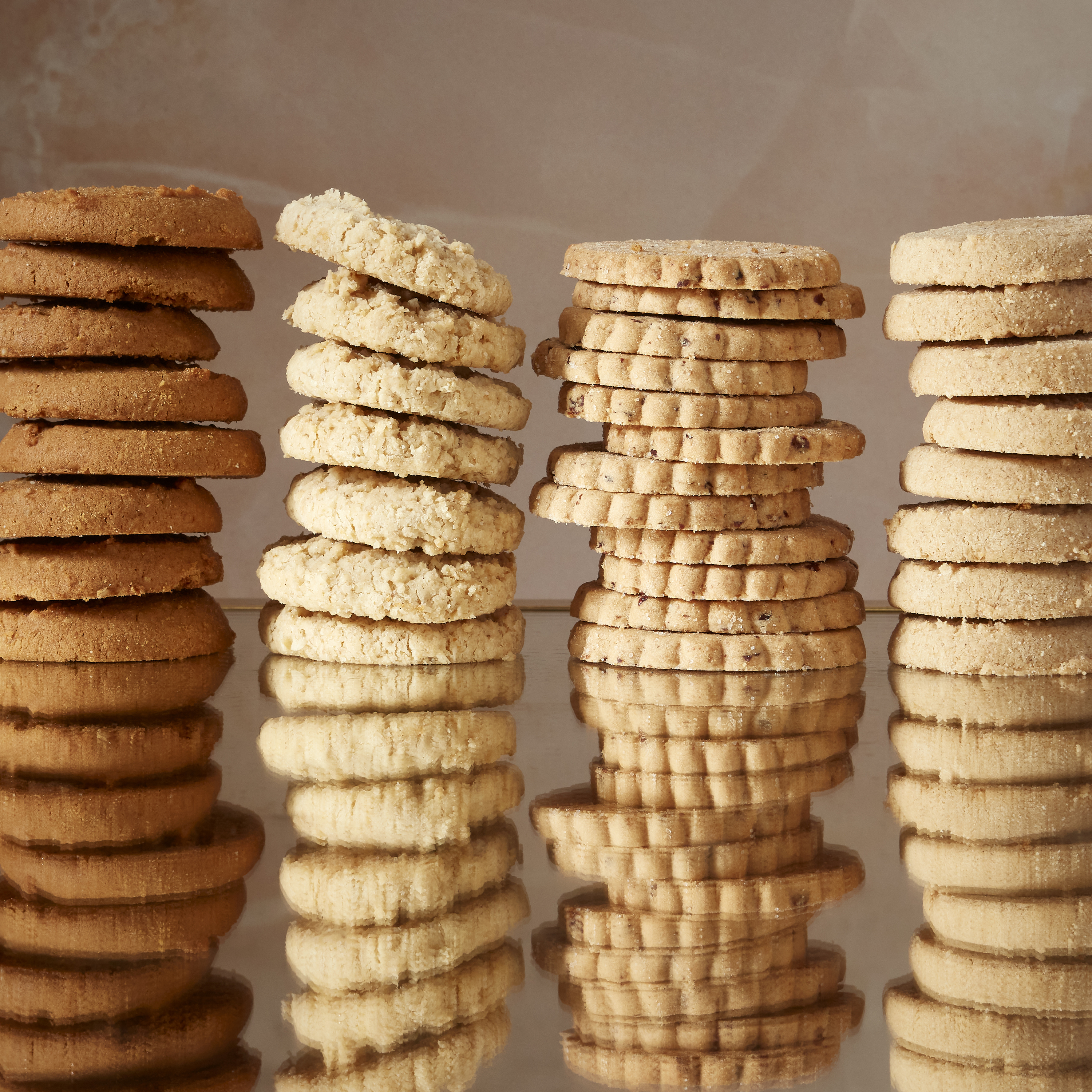 Stacks of four different types of biscuits
