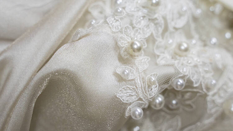 Pearl and lace wedding dress piece from a bridal shop