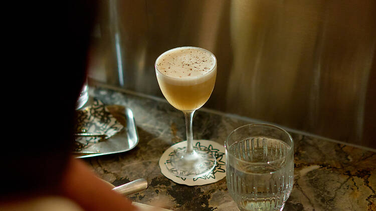A cocktail on a marble table