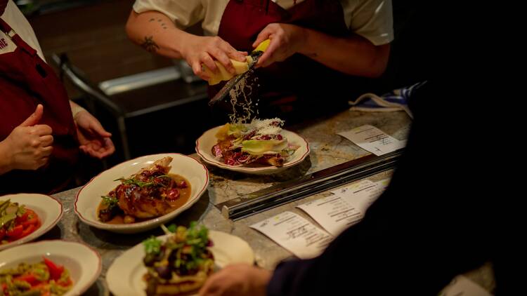 A chef plating up a dish.