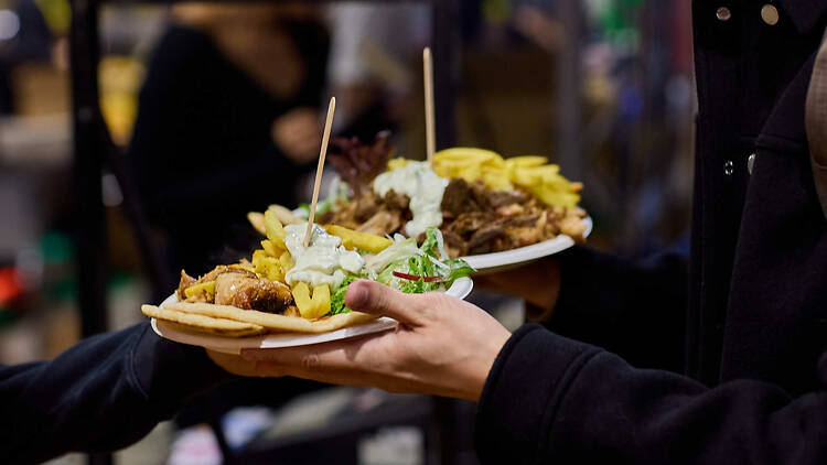 Queen Victoria Night Market People holding take away meals
