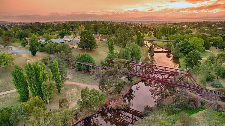 Sun sets over the Yass River and the old railway bridge.
