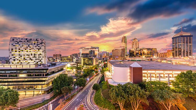 Long exposure shot of Sandton city illumiated at twilight
