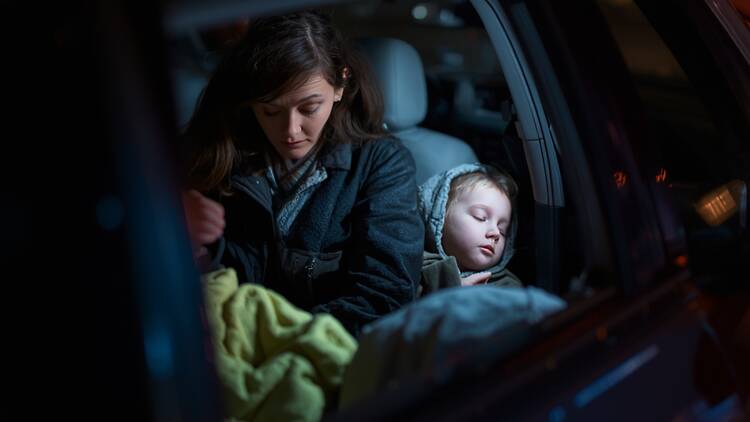Women's Housing Company Mother and child sleeping in a car