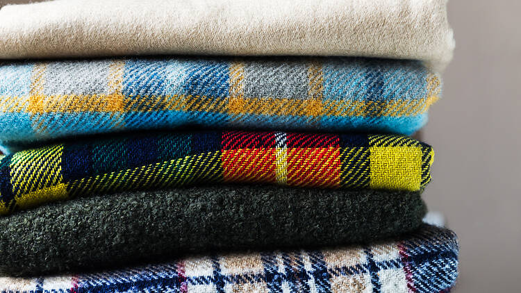Stack of woolen checked blankets