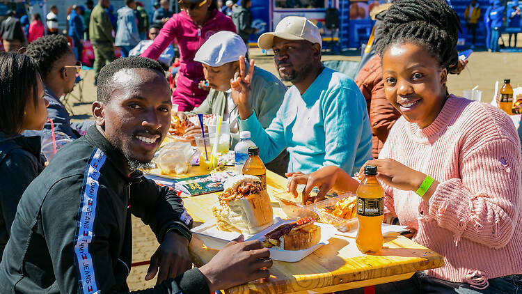 Diverse African people at a bread based street food outdoor festival