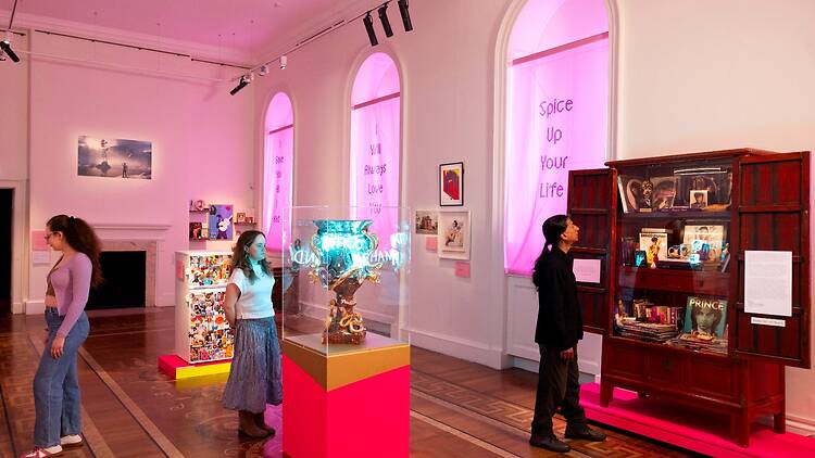 Holy Pop! at Somerset House Three visitors looking at exhibits in Somerset House’s fandom exhibition, ‘Holy Pop!’