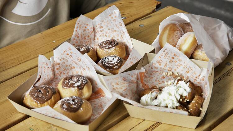 Servings of doughnuts filled with nutella and dusted with sugar