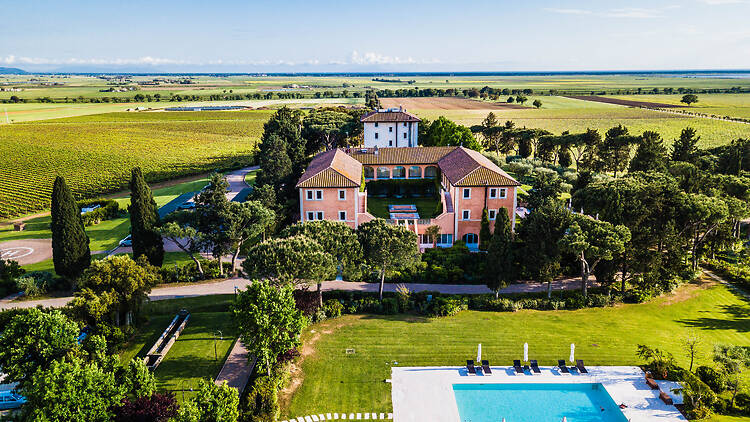 Zoomed-out view of L'Andana surrounded by Tuscany countryside