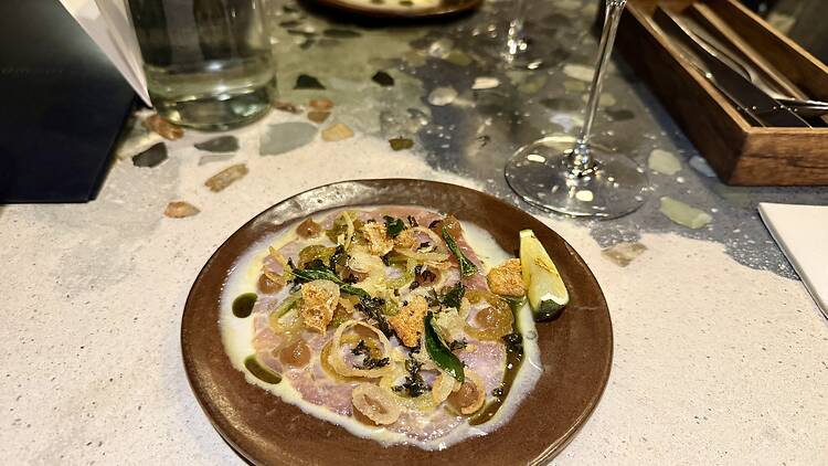 Lichen: seven-day-aged tuna with coconut, lime, crispy curry leaf and klipkombers seaweed. 